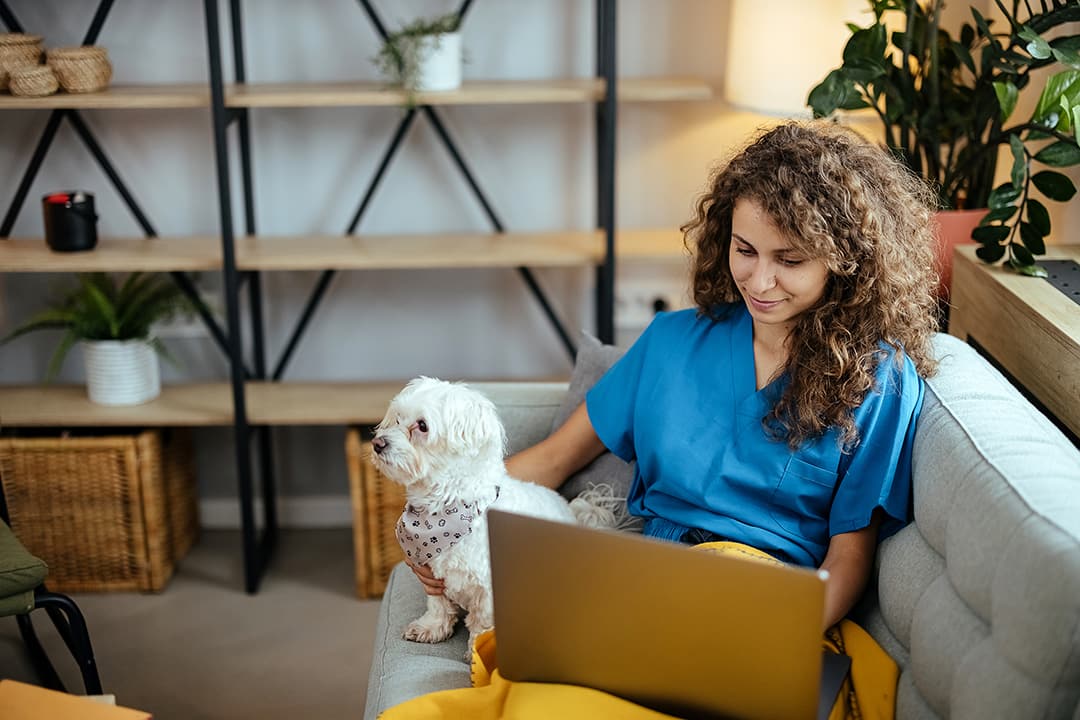 Nurse on laptop at home