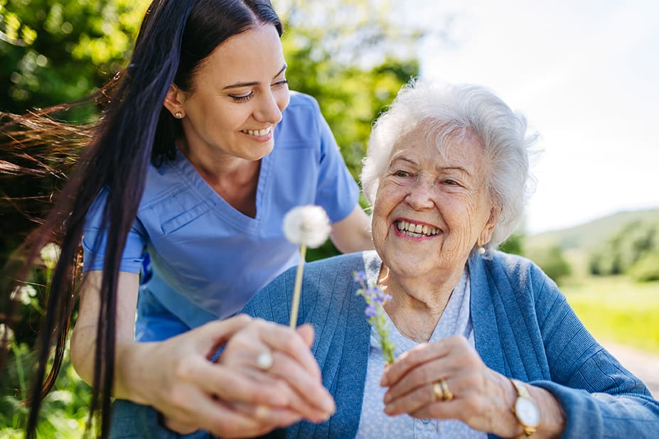 Nurse and patient outdoors 